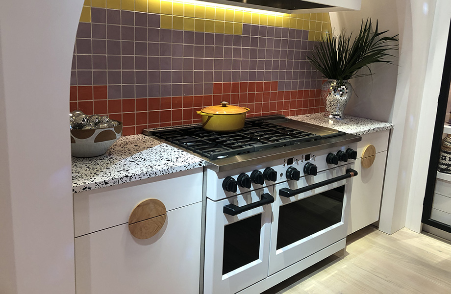 Modern Café Appliances kitchen with white stove and colourful tile backsplash