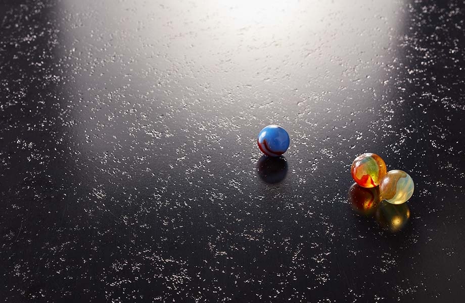 Marbles on black Formica laminate with Etchings texture