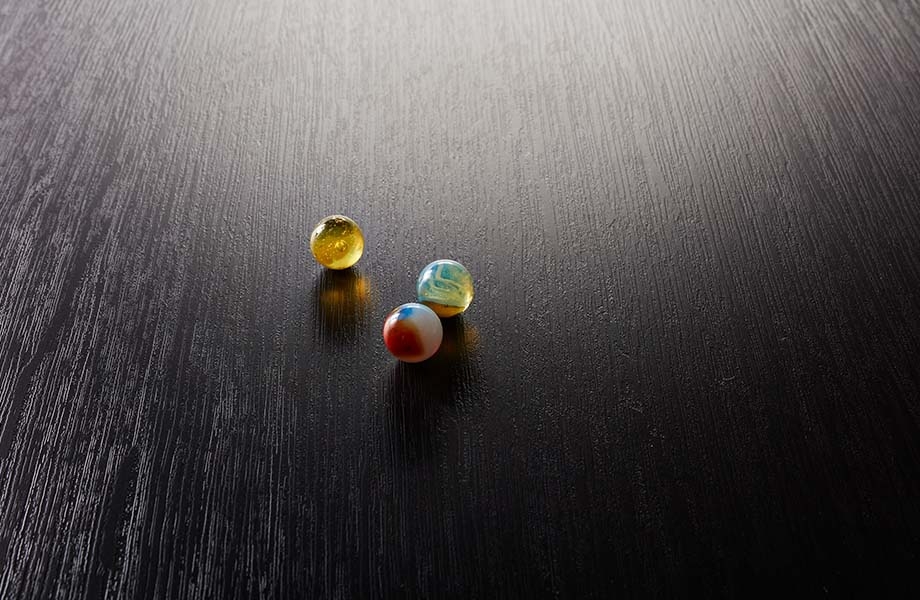 Marbles on black Formica laminate with PG Pure Grain texture
