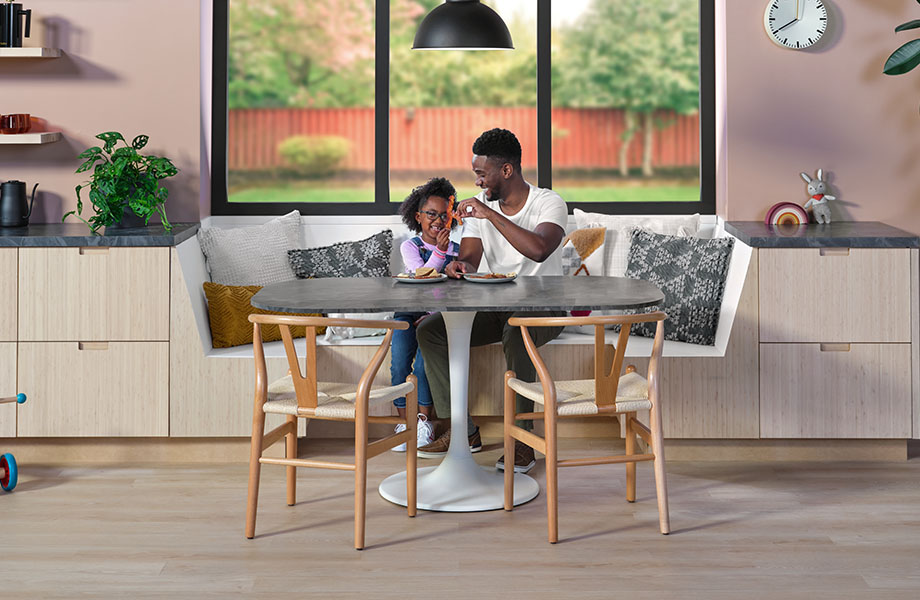 Parent and child at Formica laminate table 