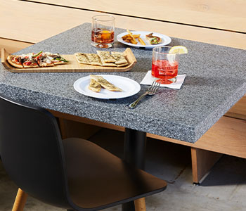 411 Grafite Terrazzo Matrix Restaurant dining table with appetizers and drinks