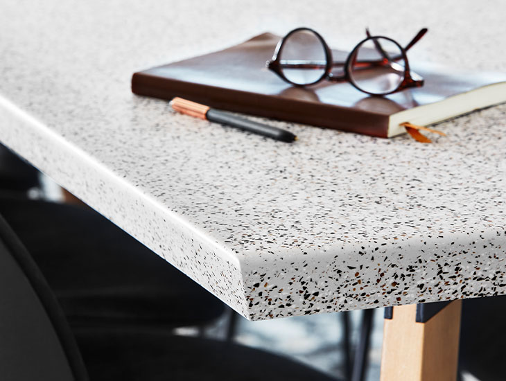 Everform Solid Surface 412 Dalmata Terrazzo Matrix table top with glasses
