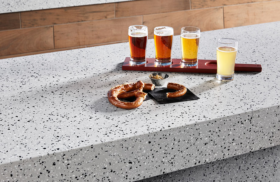410 Argento Terrazzo Matrix gray solid surface countertop with beer and pretzel 