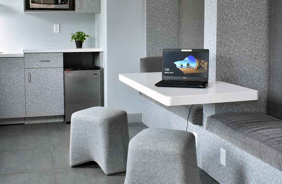 Cynthia Spray designed seating area in Folkstone Hex Formica Laminate with stools