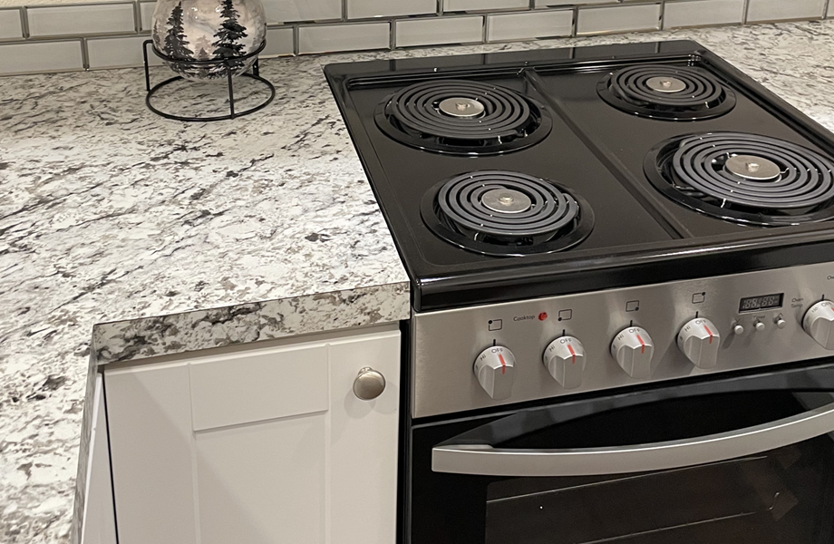 Tiny Home kitchen with White Ice Granite laminate