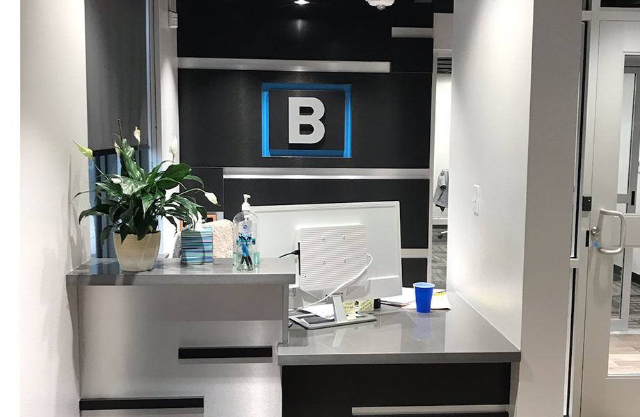 DecoMetal® Laminate Shines in Award-Winning Design by Wright Group Architects: Brushed Black Aluminum DecoMetal® is used in the law office lobby to highlight the company’s logo on the wall and the reception desk.