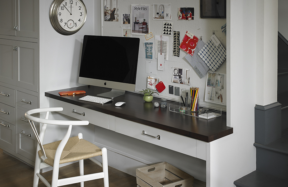 Kitchen desk with 6209 Prestige Walnut countertop, computer and pinboard