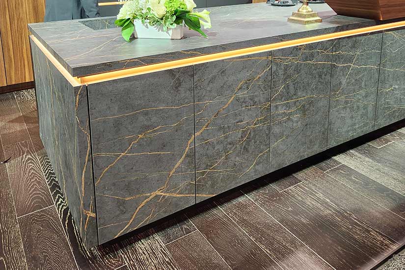 Kitchen island with green marble base and floating countertop