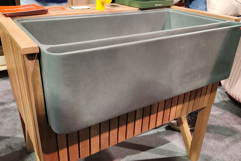 Large freestanding concrete sink with wood base