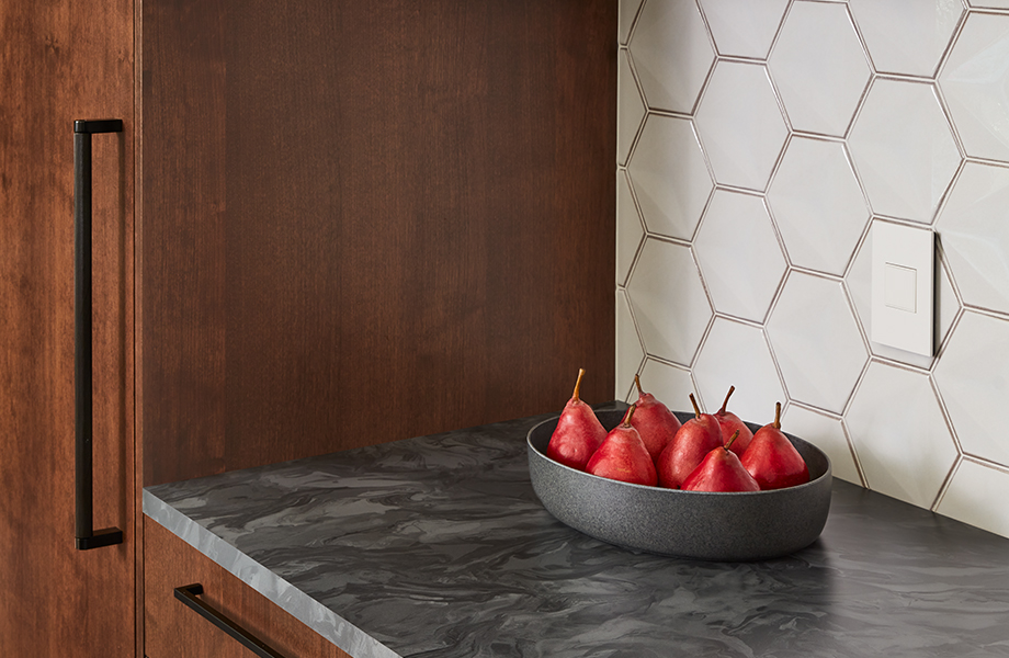 Wooden kitchen cabinets and Marbled Gray Formica laminate countertops with pears