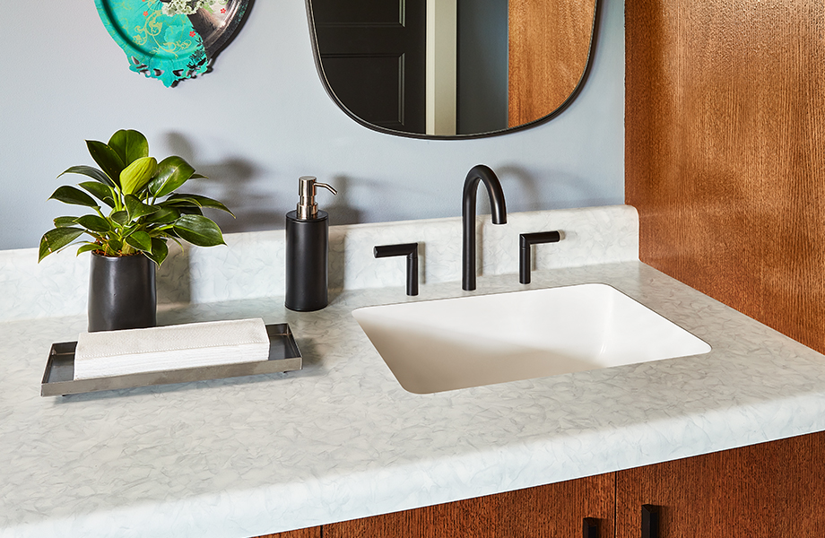 Master bathroom with Formica laminate vanity and sink