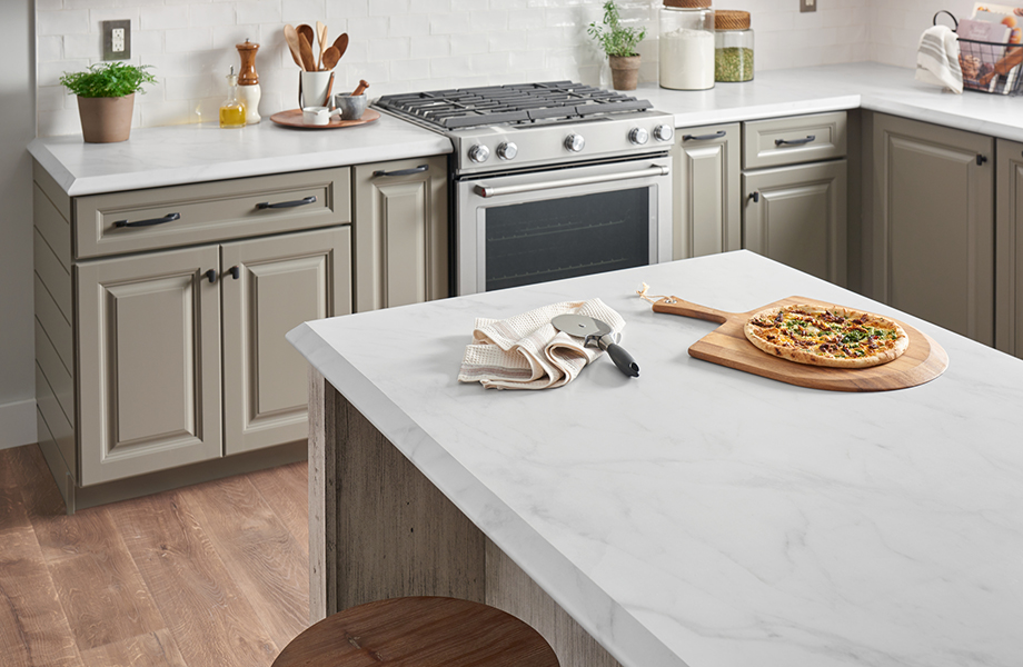5018-11 Calacatta Cava 180fx® Laminate kitchen countertops with pizza and cooking utensils