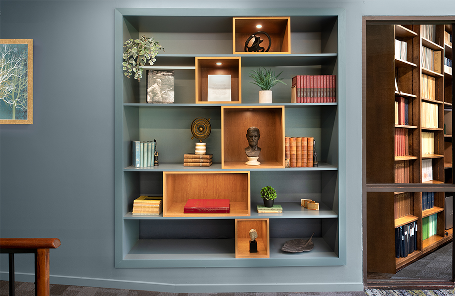 A bookshelf with books and other decor