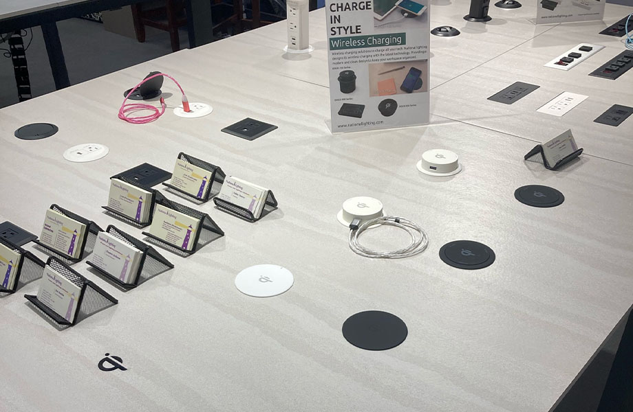 National Lighting Corporation displayed their wireless charging solutions on a table featuring Formica® Layered Sand laminate
