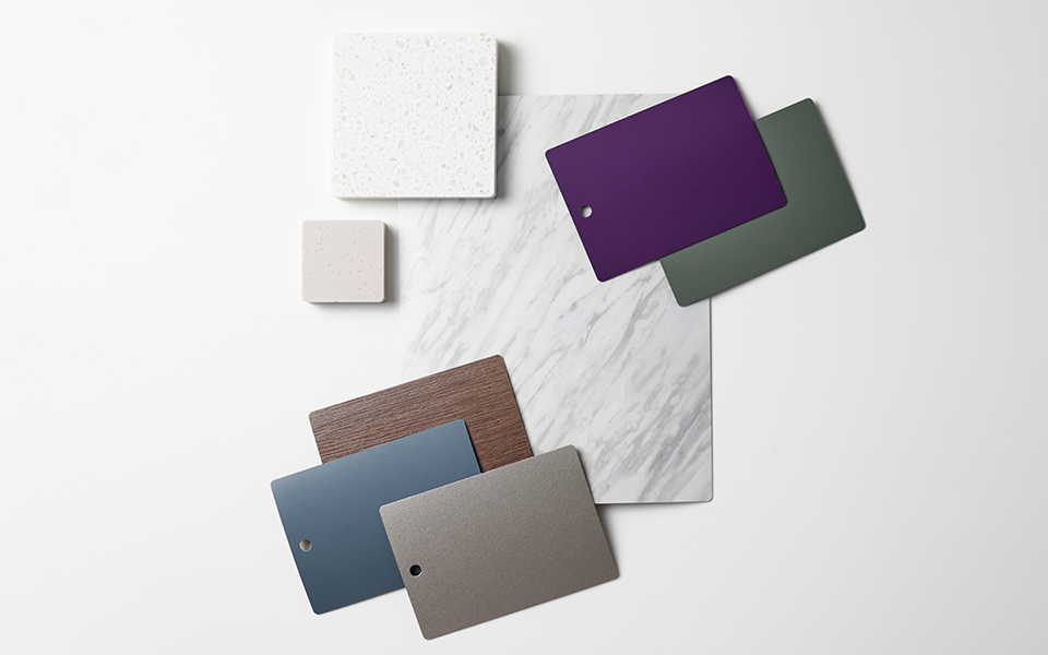 Collection of Formica laminate samples with a white marble look and nature-inspired solids
