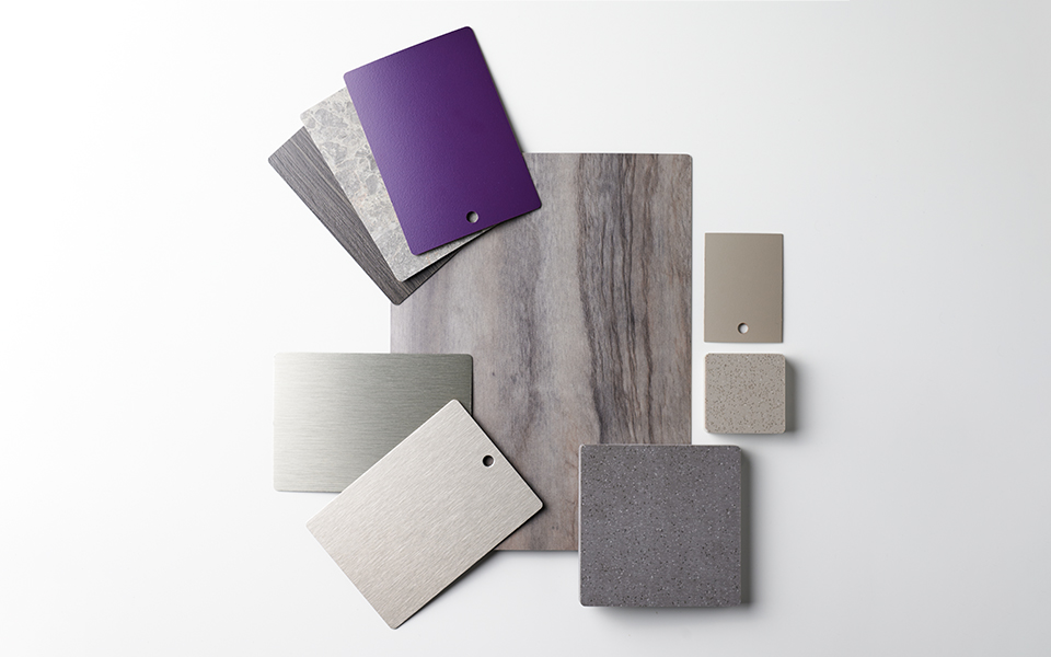 Collection of Formica laminate samples in complementary grays, browns and shimmery metals