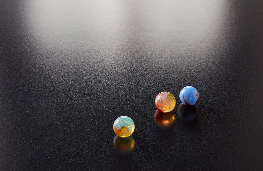 Marbles on black Formica laminate with Artisan texture