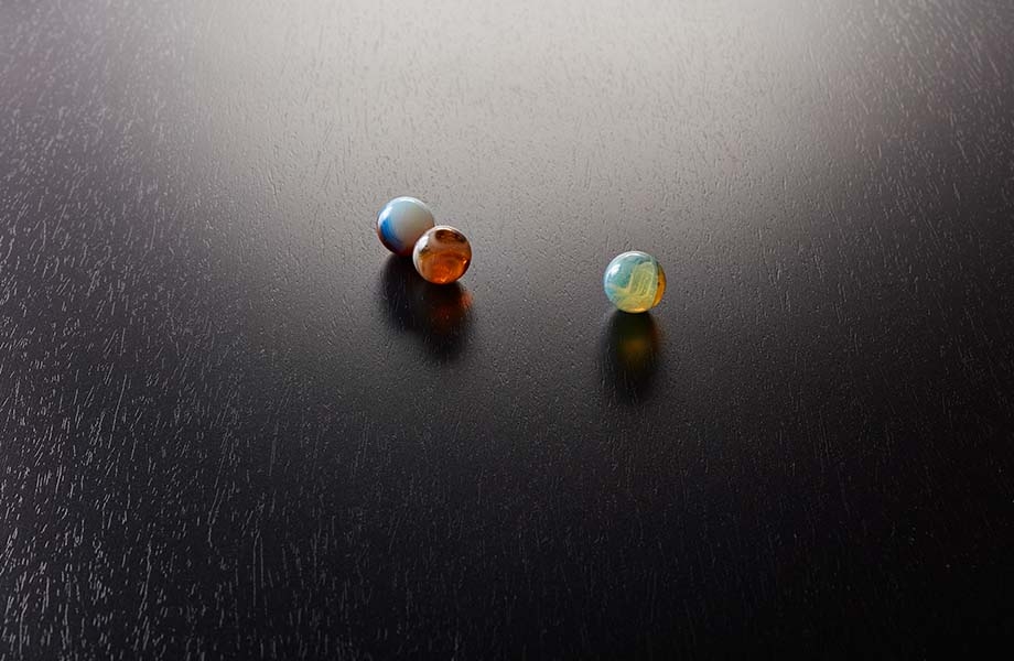 Marbles on black Formica laminate with NG Natural Grain texture
