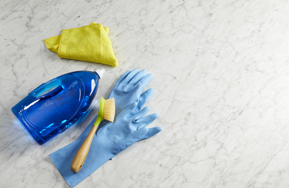 cleaning laminate with scrub brush and dish soap