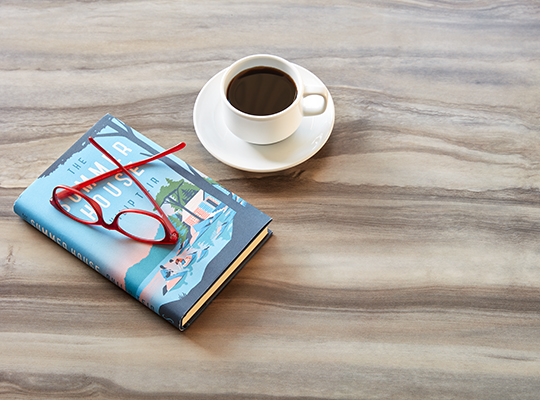 Marbled Formica laminate kitchen counter with coffee, book and glasses