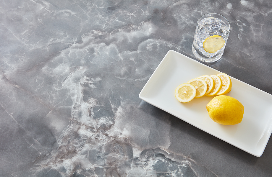 Formica laminate restaurant table top with sliced lemon and water