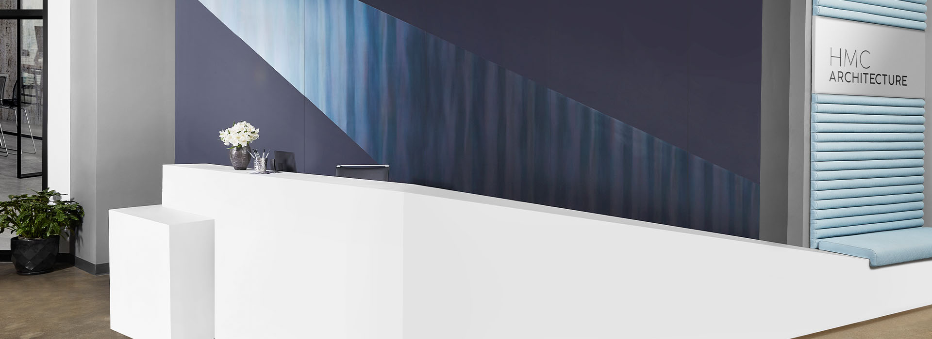 408 Luna Brite White reception desk with M9421 Dark Rolled Steel and 5323-AN Nocturne wall
