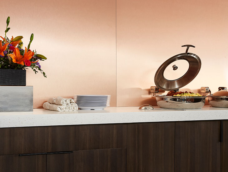 M9428 Copper Stainless metal wall panels and buffet line with 413 Tumbled Glass counter and 5790 43 Nut Brown Cherry cabinet
