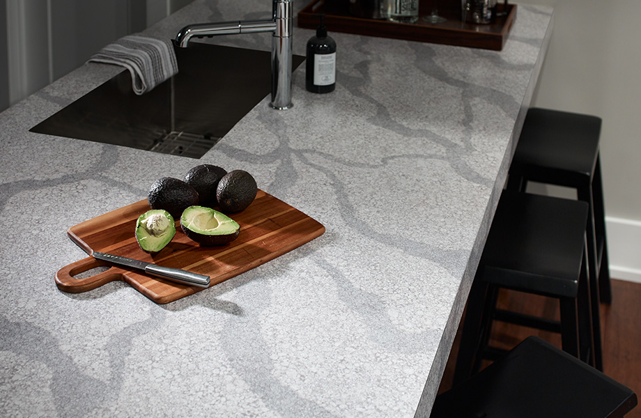 This composite was inspired by quartz but made by human ingenuity using concrete, recycled glass and a bit of design magic. Exquisitely detailed particulates fill in the background while a sweeping blue gray vein fractures the slab. This artistic composition makes odds and ends beautiful and modern with the resourcefulness of its creation.