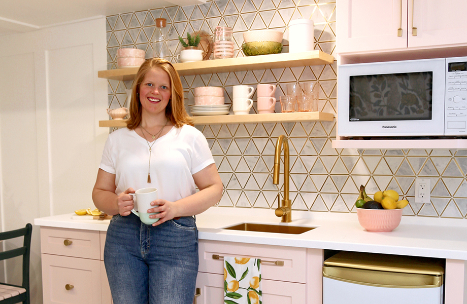 Virginia Fynes in pink kitchen she desgined