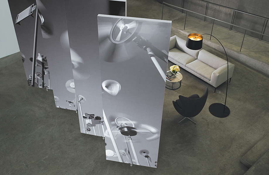 Formica Envision pivot wall custom printed with fan images near a couch and chair