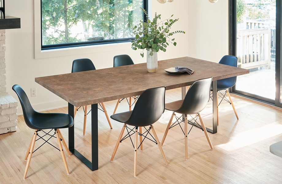 Dining area with Patine Bronze laminate tabletop and chairs