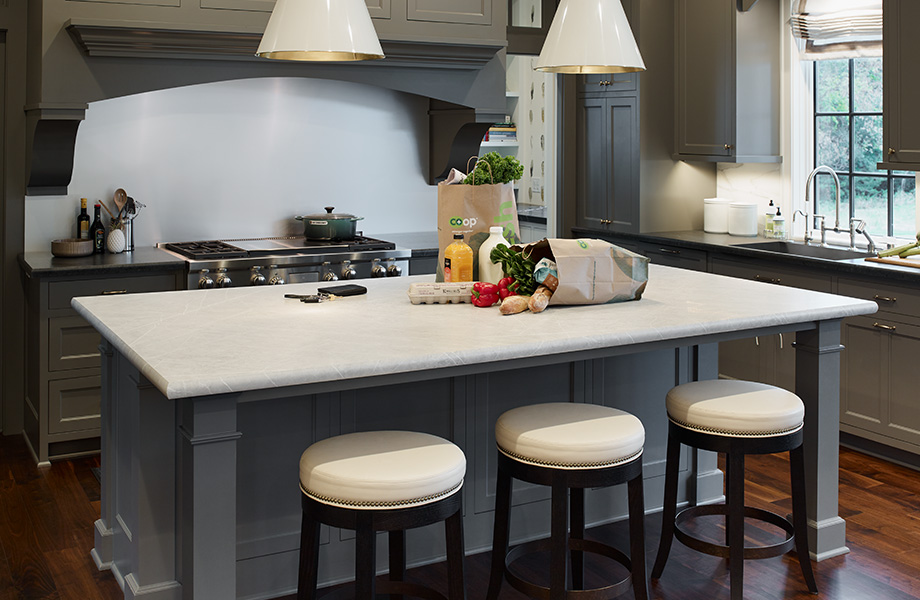 Elegant grey and white kitchen with 7402-11 Pietra Grafite 180fx Laminate island countertop with groceries