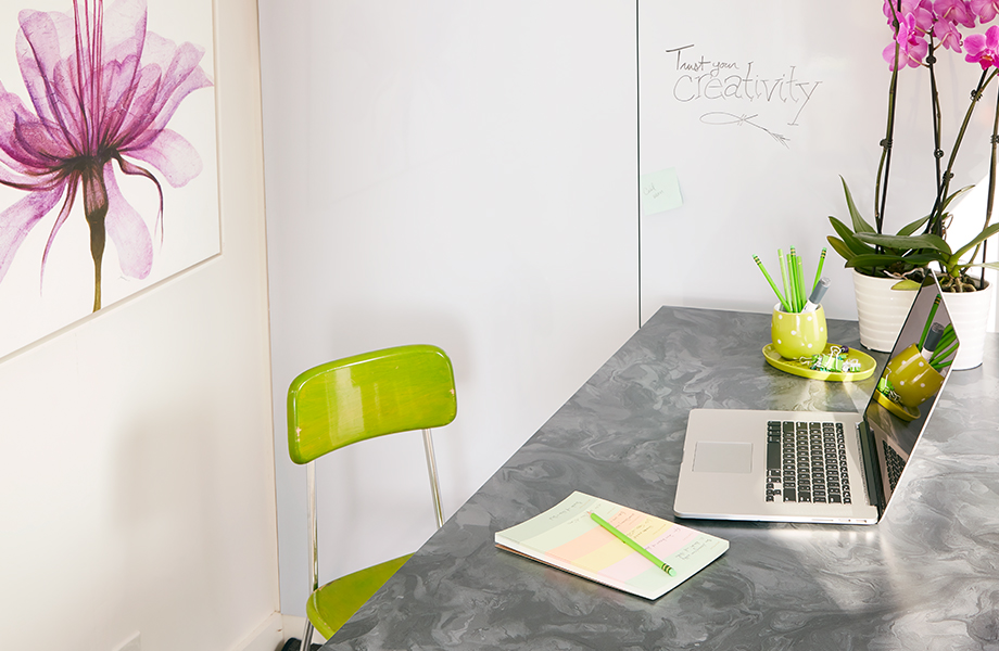 Marbled Gray Formica laminate desk in home office with laptop and artwork