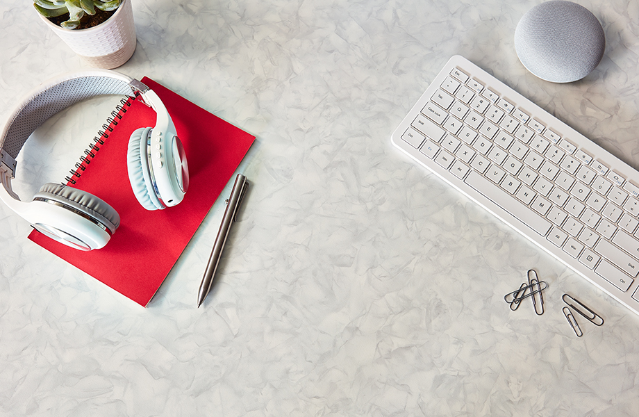 Formica laminate bathroom desktop with keyboard and headphones