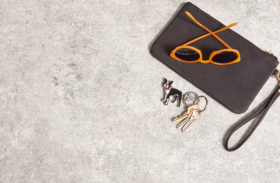 Close-up of Formica laminate countertop with wallet, sunglasses and keys