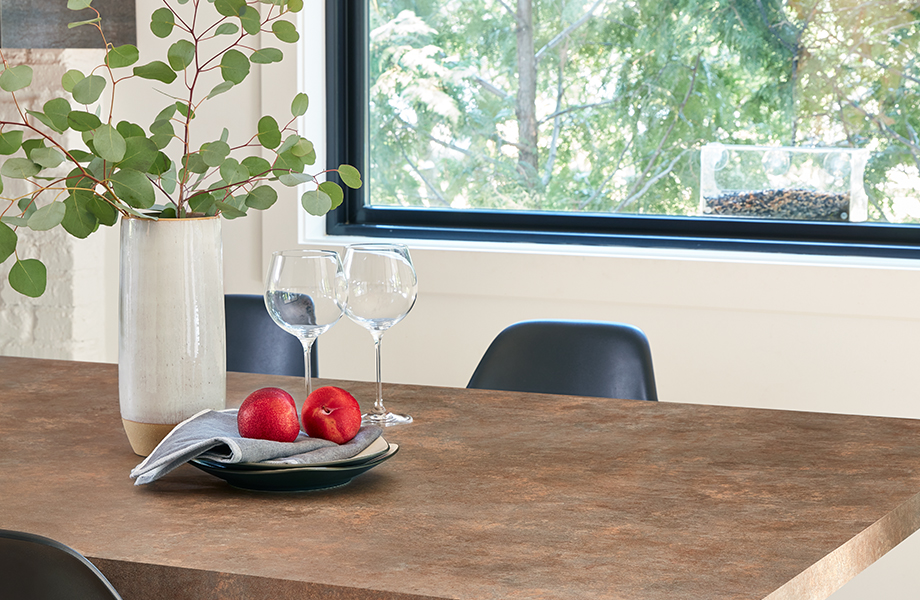 Custom Formica laminate dining room table with wine glasses and fruit