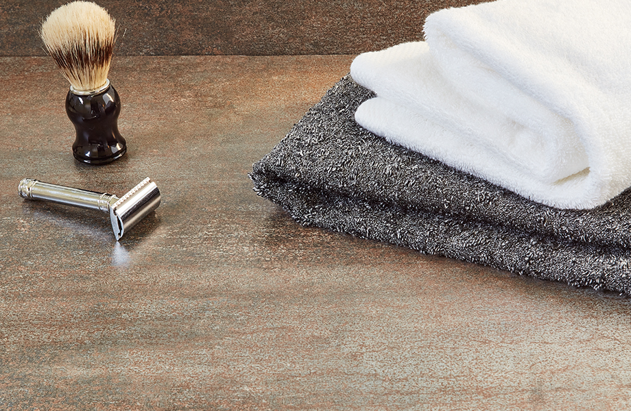 Close-up of Formica laminate bathroom counter with shaving supplies