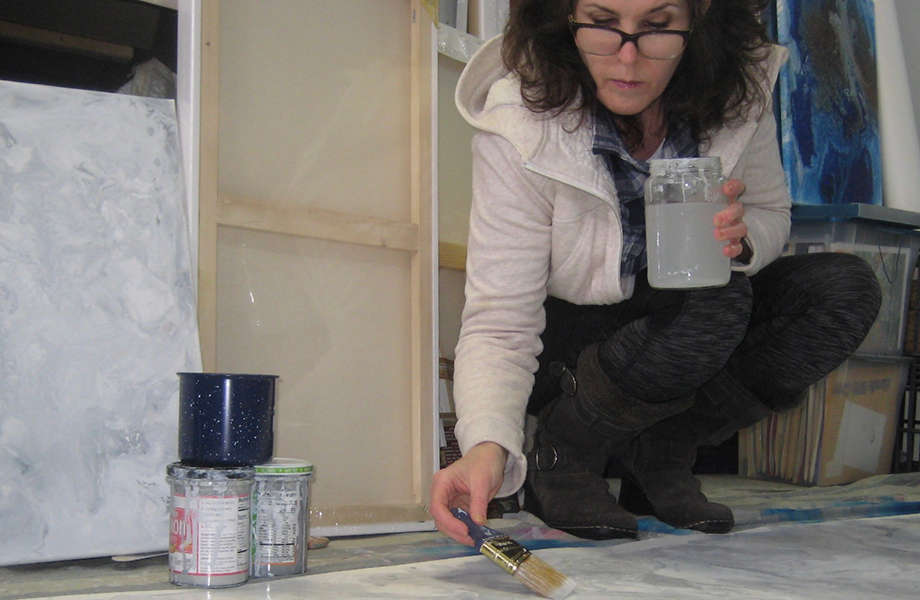 Artist Kathleen (Fred) Streitenberger creates the artwork for Marbled Gray Formica laminate