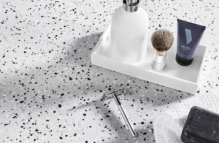 410 Argento Terrazzo Matrix on solid surface countertop with razor and soap dish