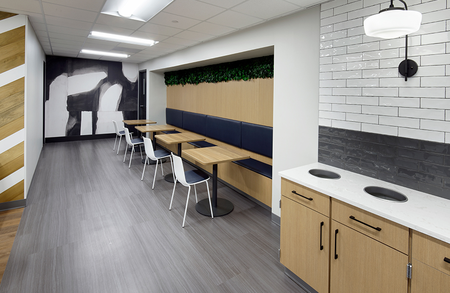 Cafeteria trash and dining areas with cabinets and countertops