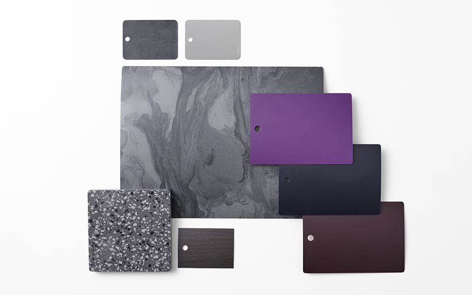 Collection of dark Formica laminate samples with painted marbled looks, metallics and terrazzo acrylic solid surfacing