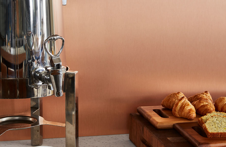 M9428 Copper Stainless wall panel with coffee and pastries on counter