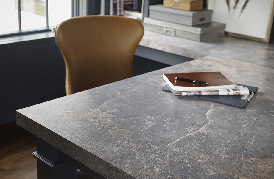 Home office with Formica® Laminate 7405-34 Istanbul Marble desktop with notebook and chair
