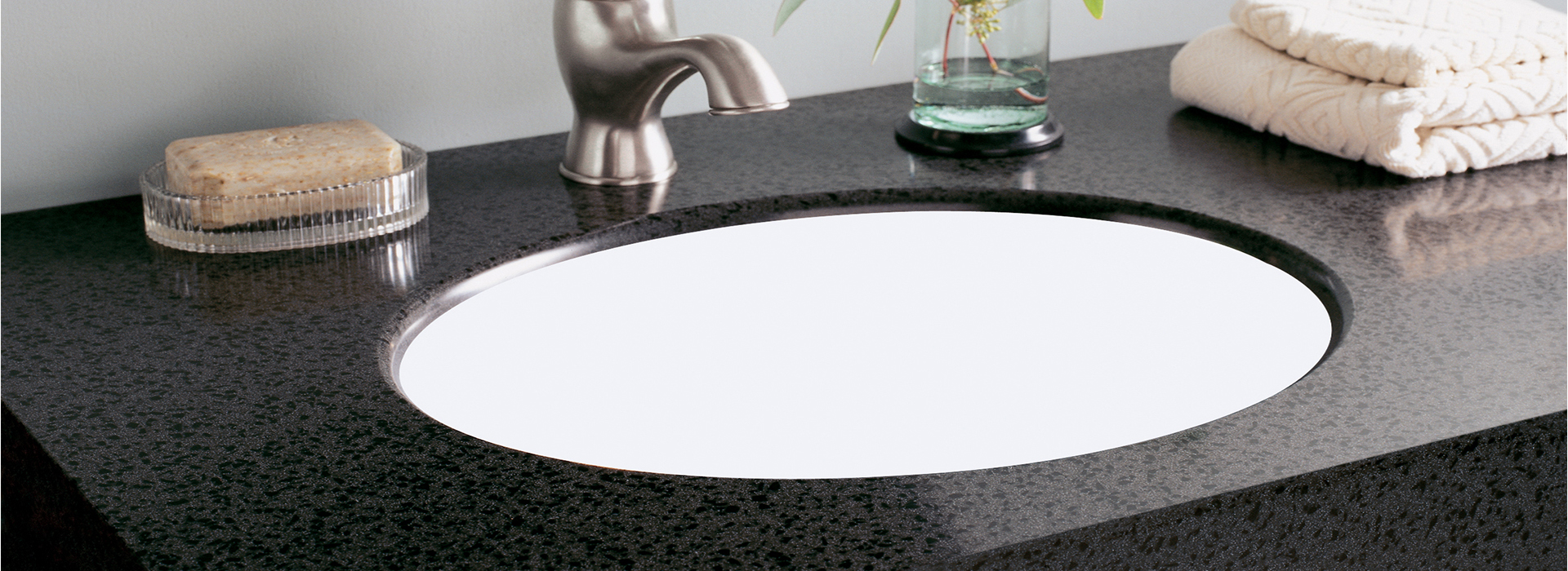 Bathroom sink with soap and plant L075 501 Black Lava Formica Solid Surfacing