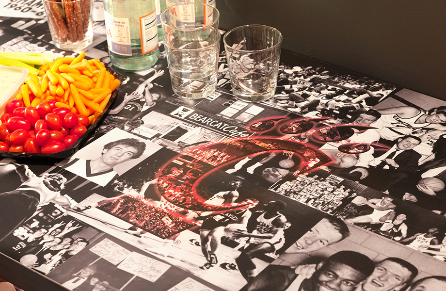A countertop with team graphics and food and drinks