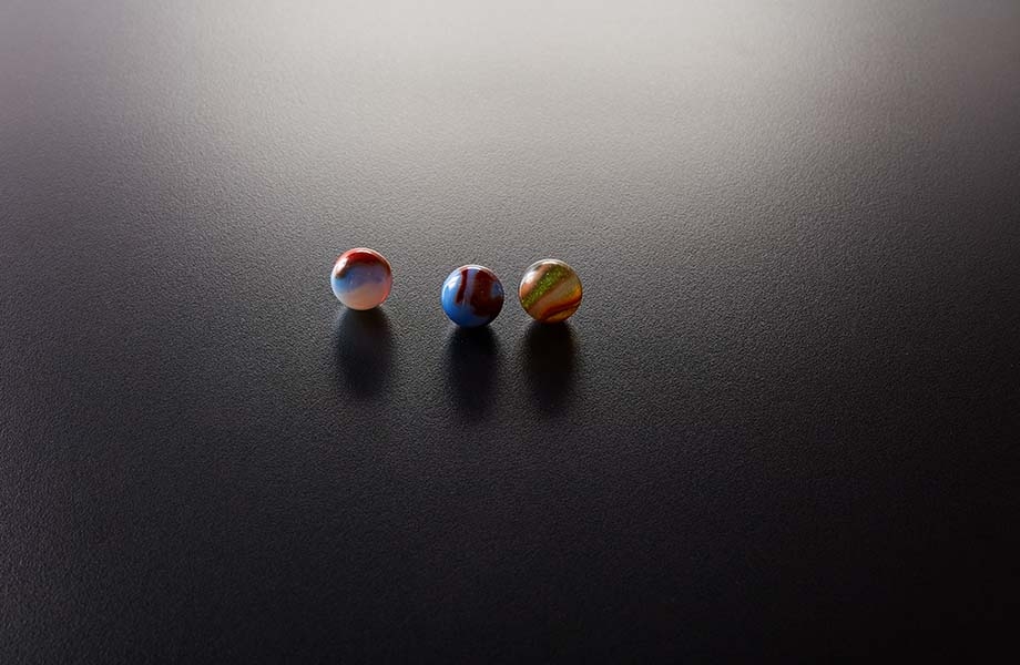 Marbles on black Formica laminate with Matte texture