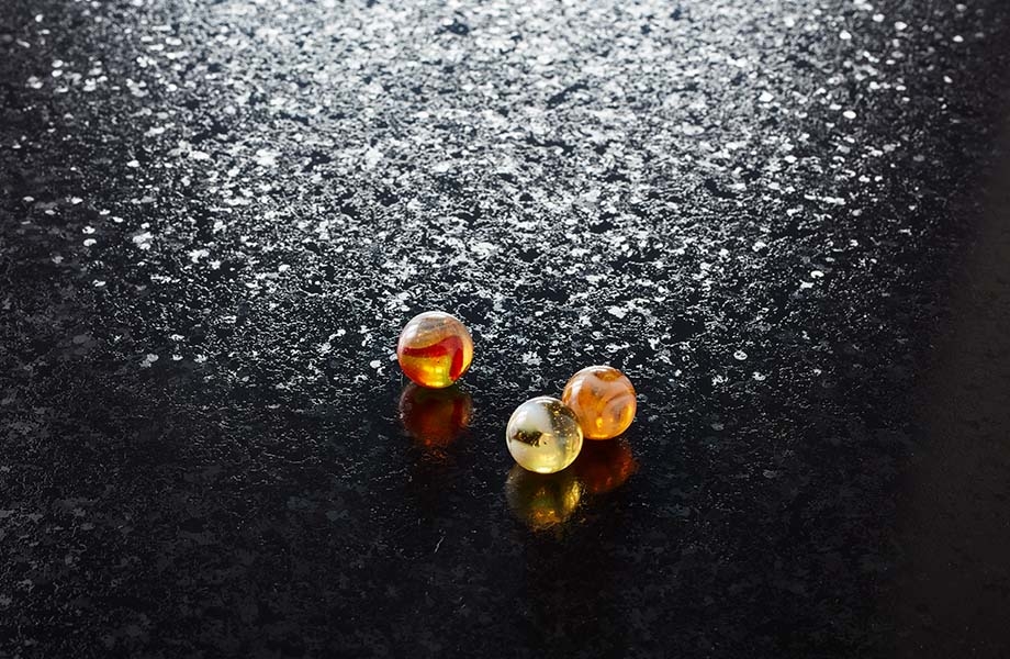 Marbles on black Formica laminate with RD Radiance texture