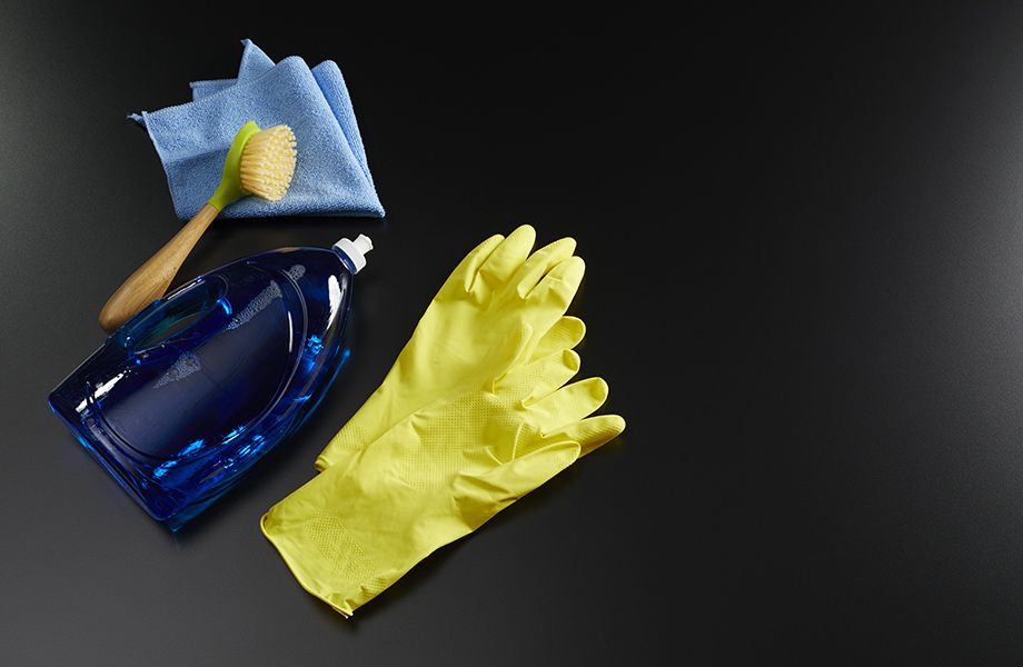 cleaning solid surface with scrub brush and dish soap
