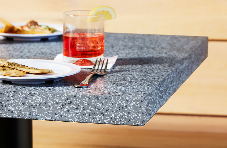 411 Grafite Terrazzo Matrix Restaurant acrylic countertop dining table with appetizers and drinks